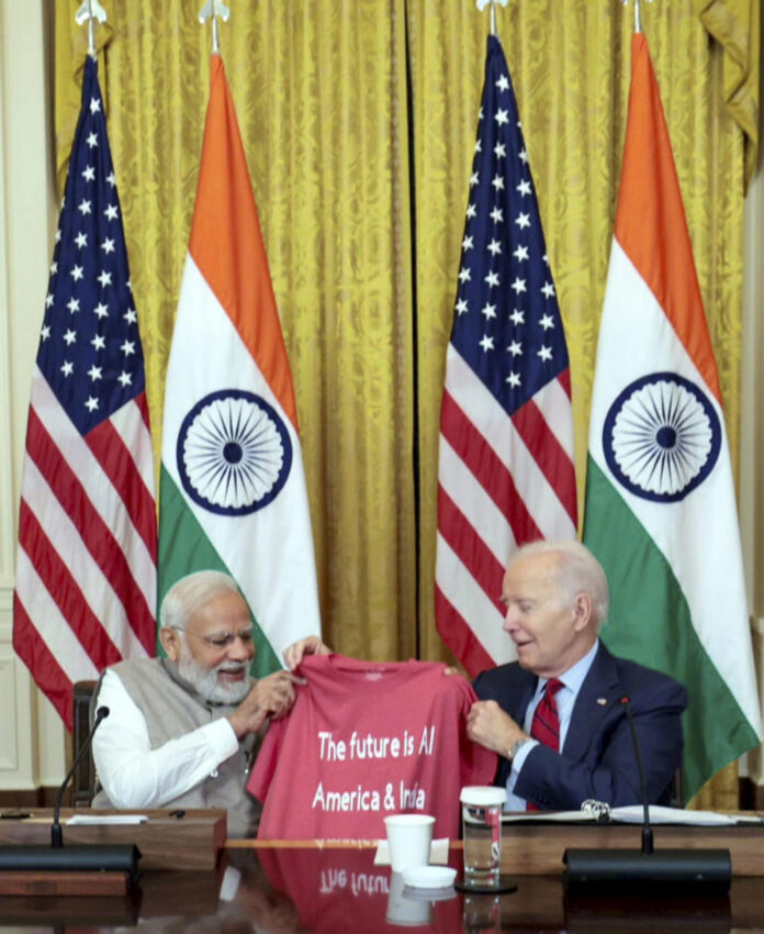 Modi and joe Biden With Tshirt in Their hands