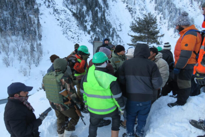 People being rescued in landslide by the army