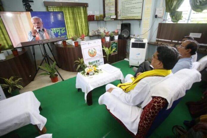 Tripura CM Manik saha watching PM Modi Show