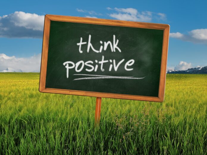 Think Positive written on a board