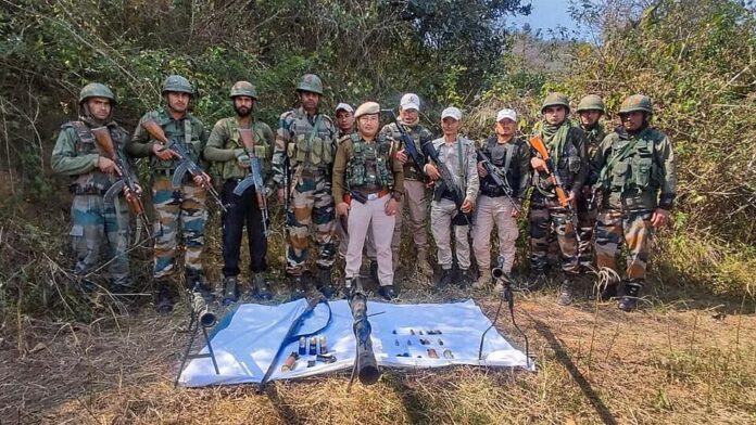 An earlier picture of Assam Rifles and Manipur Police personnel with seized arms