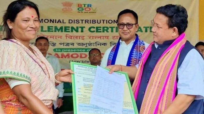 Landless families in Parbatjhora receiving land titles from Assam officials
