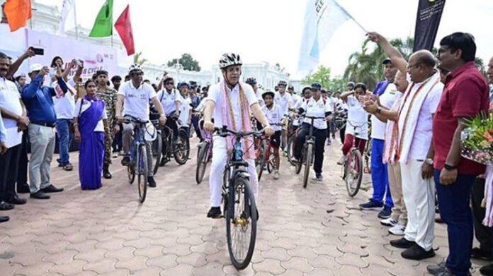 Tripura Governor Joins Cycling Rally in Agartala Tripura Governor Indrasena Reddy cycling during fitness event in Agartala
