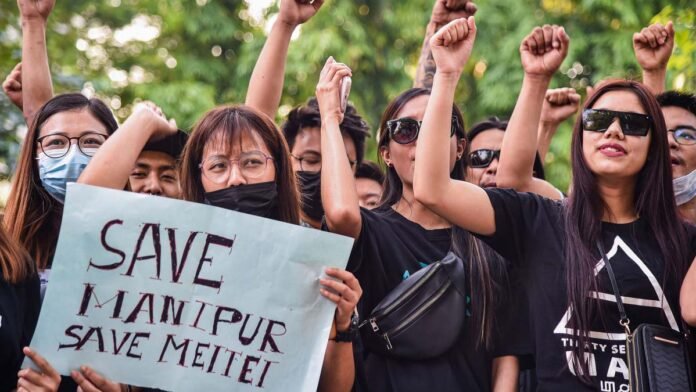 People of Manipur protesting in Imphal against removal of the state's name from a government bus