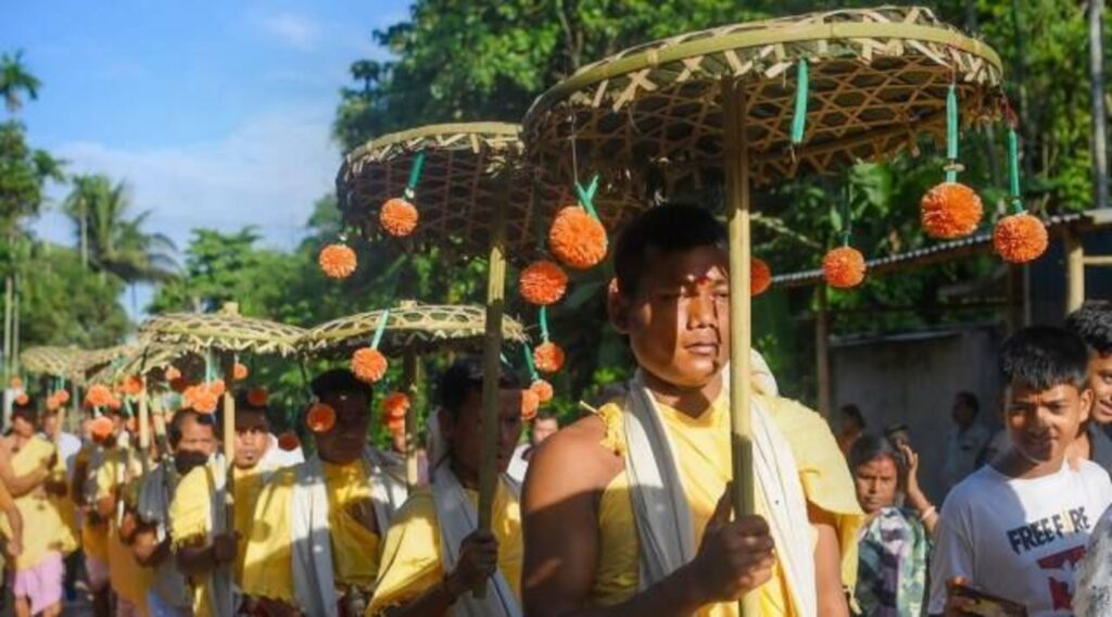 People Holding Umbrella in Kharchi Puja