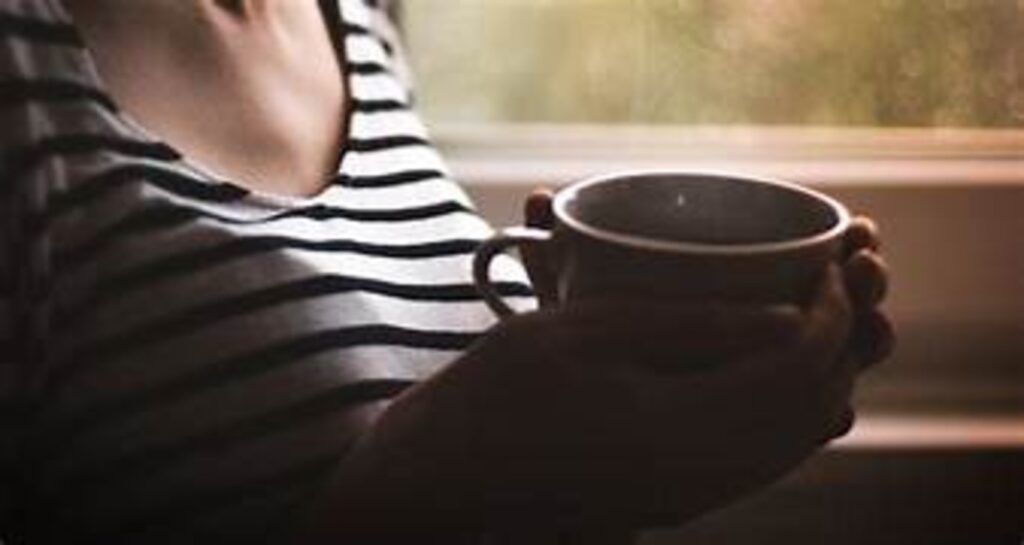 Girl holding cup of beverage