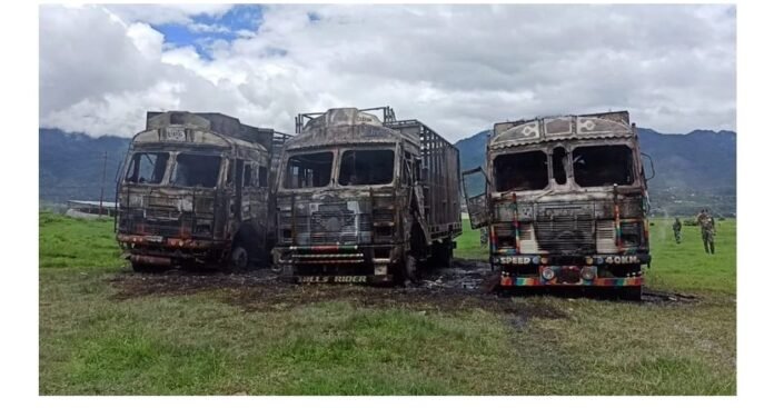Damage trucks Three trucks set ablaze woman shot dead in Imphal