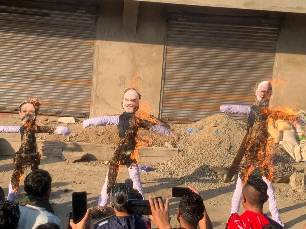 Effigies of PM Modi Amit Shah and JP Nadda burned