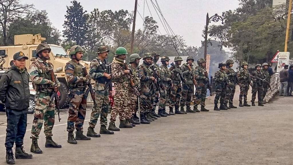 Security personnel stand guard in Imphal following imposition of President's rule