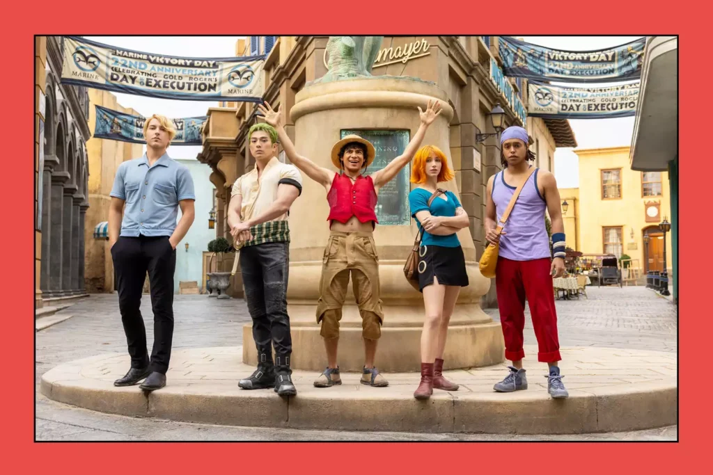 Cast of One Piece live-action series posing together on set