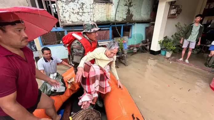 Indian Army rescuing flood victims in Assam using boats