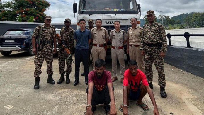 Arunachal police officers inspecting stolen dumper truck