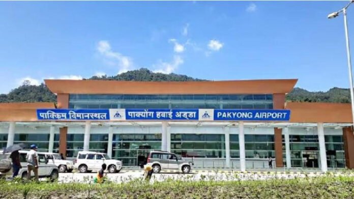 Aerial view of Pakyong Airport surrounded by green hills in Sikkim