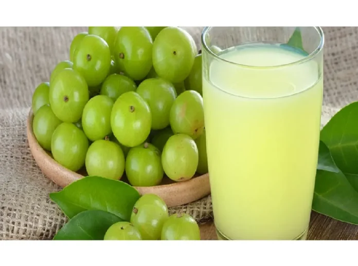 Fresh Amla Juice in a Glass Freshly prepared amla juice in a clear glass