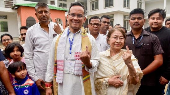 Congress MP Gaurav Gogoi and his mother Doli Gogai show ink-marked fingers after casting votes for the Assam Assembly Elections 2026, in Jorhat on Thursday