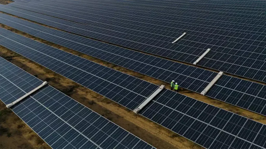Large-scale solar panels installed across a renewable energy project site in Manipur