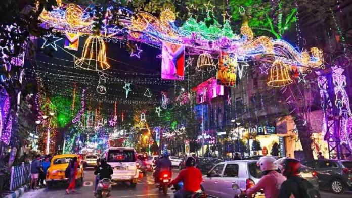 Traffic police managing diverted vehicle movement near Durga Puja pandal construction site in Kolkata