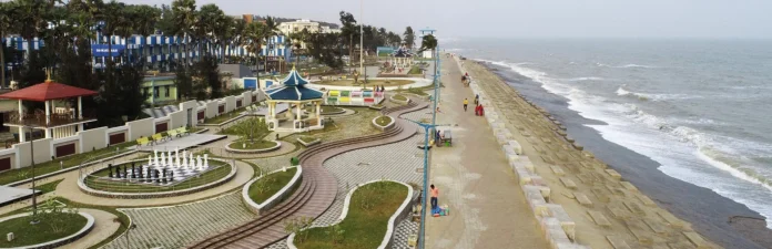 Modern marine promenade with beachfront resorts and illuminated coastal walkway along Digha Sea Beach in West Bengal