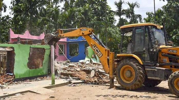 Eviction teams conducting anti-encroachment operation on government land in Assam