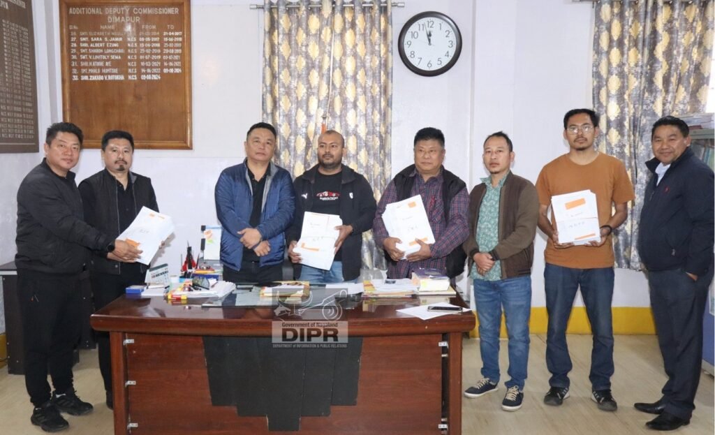 Election officials reviewing voter records during electoral roll revision process in Nagaland