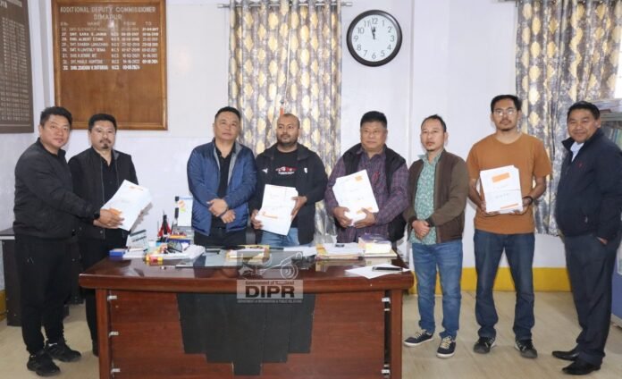 Election officials reviewing voter records during electoral roll revision process in Nagaland