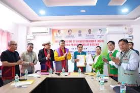 Sitang village residents signing hydropower project agreement documents during official consultation meeting