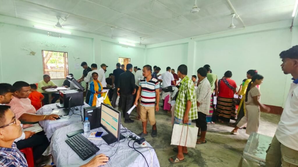 Government officials interacting with residents during Jan Sunwai outreach and welfare service camp in Sepahijala.