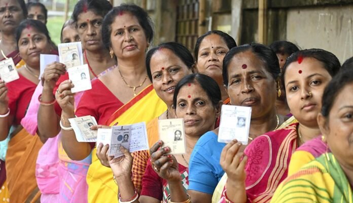 Election officials reviewing voter lists ahead of TTAADC village committee elections in Tripura.