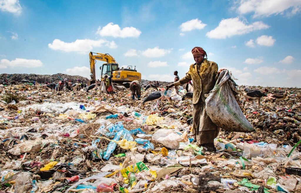 Waste management officials inspecting a garbage dumping site in Meghalaya after regulatory action against unscientific disposal practices.