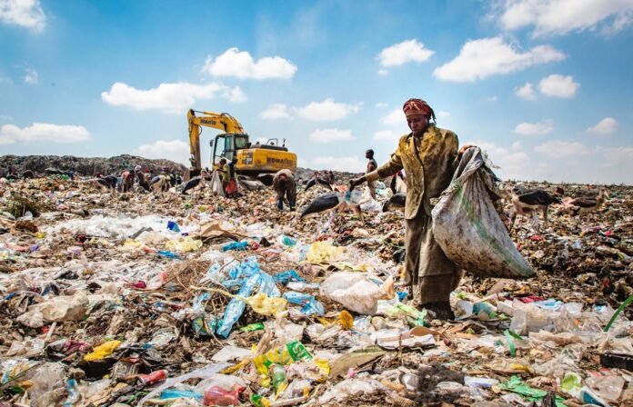 Waste management officials inspecting a garbage dumping site in Meghalaya after regulatory action against unscientific disposal practices.