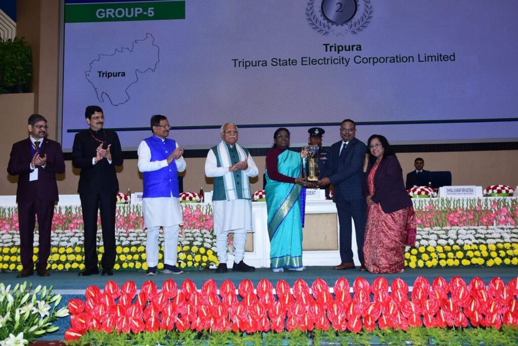 National-level medal-winning athletes from Tripura receiving enhanced cash incentive awards during a sports recognition ceremony.
