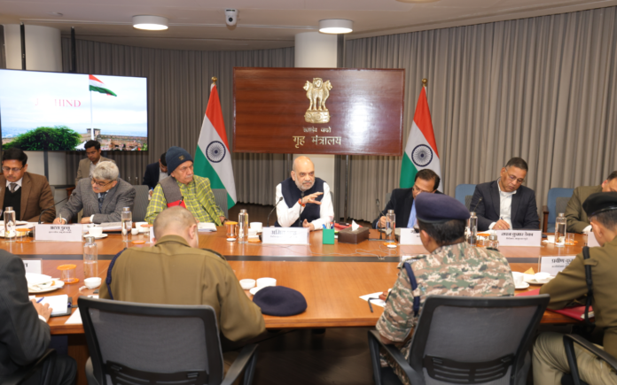 Union Home Minister Amit Shah addresses officials during a security meeting on the Total Territorial Defense Model in Salbagan.
