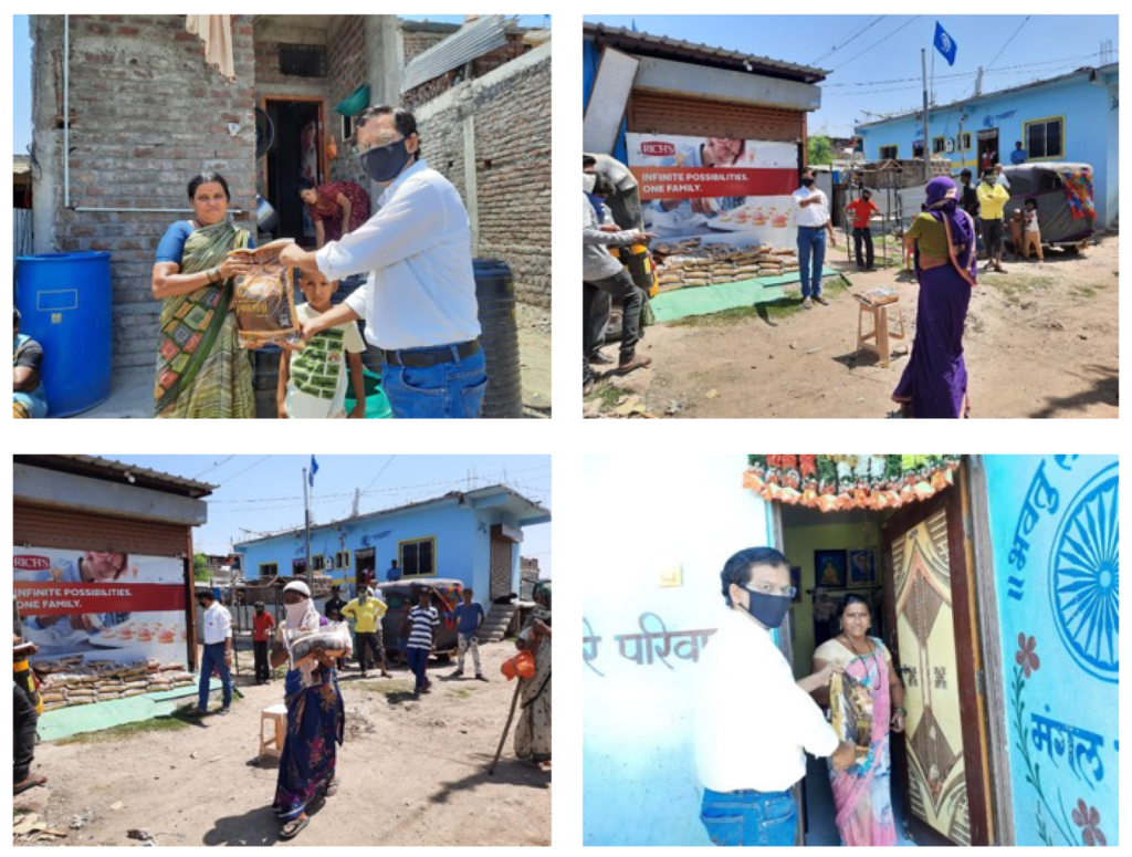 Beneficiaries collecting essential food items from a government-supported distribution center in Assam.