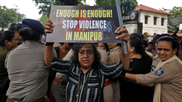 Community members gathered during protests after cancellation of planned detainee release in Manipur