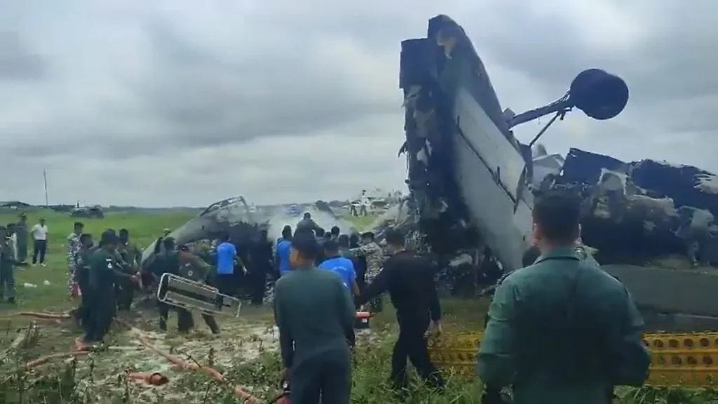 Emergency personnel respond at the site of an Indian Air Force AN-32 aircraft crash at the Jorhat airbase in Assam.
