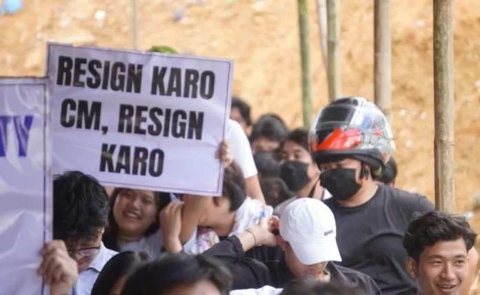 Protesters holding banners during demonstrations over corruption allegations against Arunachal Pradesh leadership