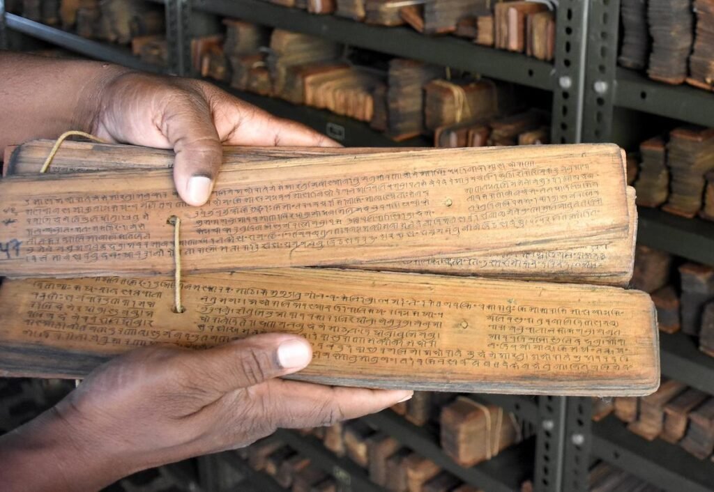 Museum staff digitizing centuries-old royal manuscripts at Manipur State Museum for preservation and archival restoration.