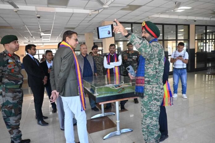 Security personnel monitor electronic surveillance systems during an intelligence operation near the India-Myanmar border.