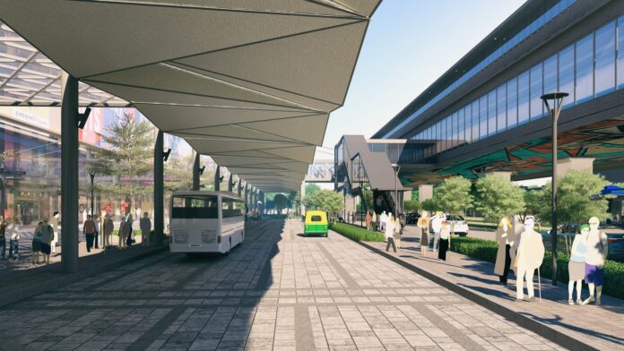 Construction site of a multi-modal transit hub in Agartala with workers and infrastructure development activities in progress.