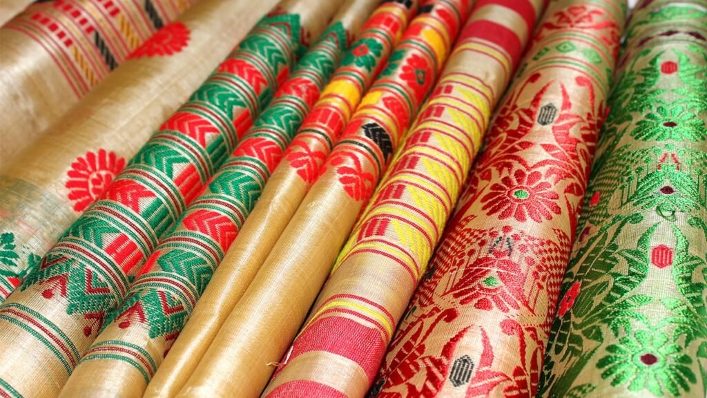 Traditional Assamese Muga Silk fabric displayed as part of a luxury branding initiative.