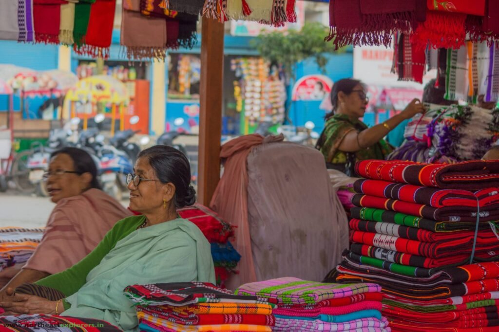 Premium handloom store featuring traditional Manipuri textiles inside a major metropolitan airport terminal.