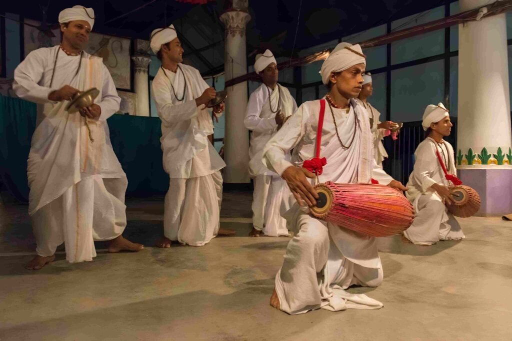 Large crowd watching traditional sports competitions during a cultural festival on Majuli Island in Assam.