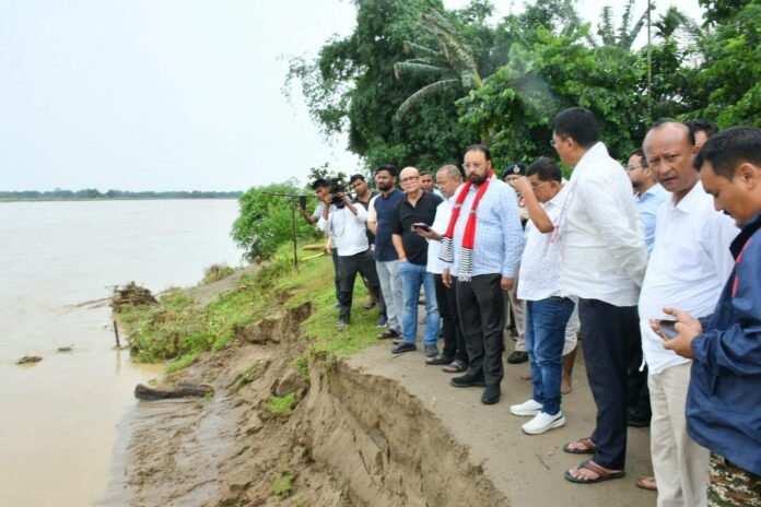 Floodwaters inundate villages in Assam's Dhemaji district as rescue teams assist displaced residents during severe monsoon flooding.