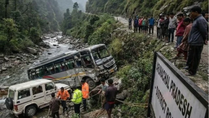 Rescue personnel and local residents gather near the site where a vehicle fell into a gorge in Arunachal Pradesh.