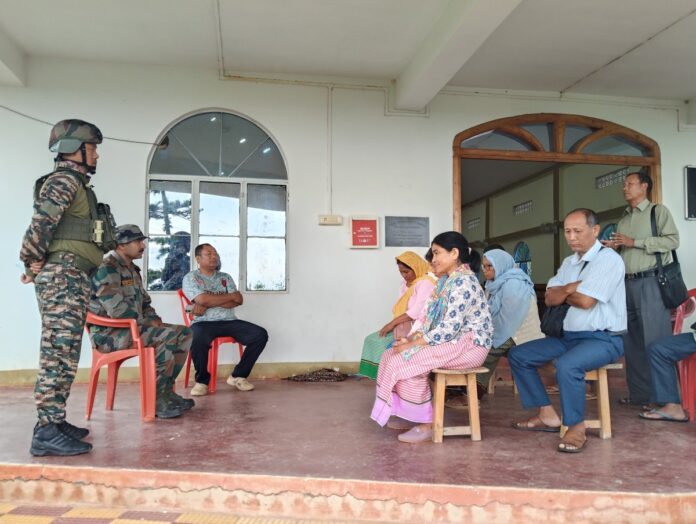 Assam Rifles personnel interacting with local residents during a community outreach programme at Nambol Company Operating Base in Bishnupur.