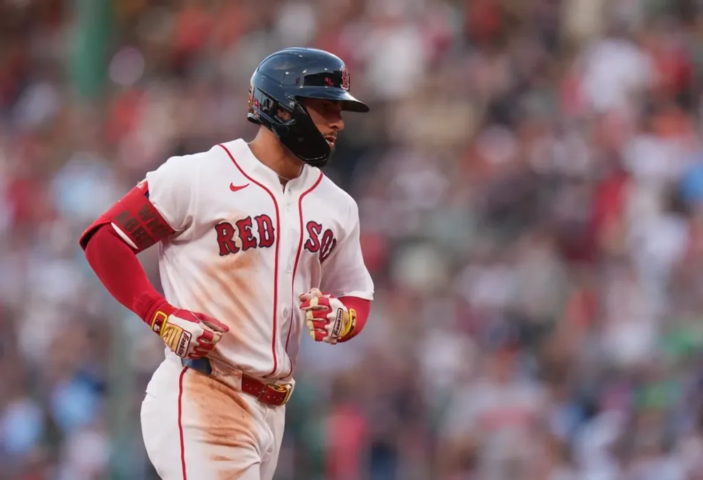Boston Red Sox players celebrate an 8-1 victory over the Baltimore Orioles at Fenway Park.
