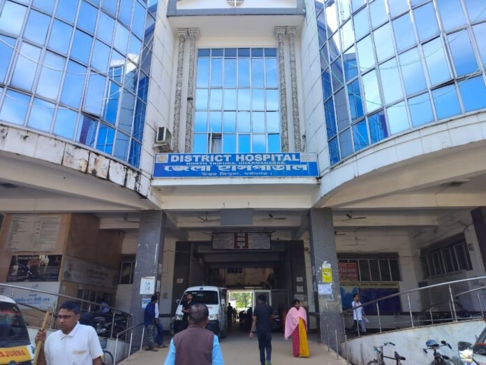 Dharmanagar District Hospital building under administrative scrutiny following allegations of financial irregularities in maintenance operations.