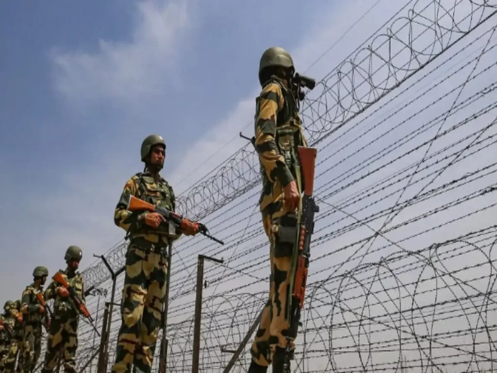 Officials facilitating the repatriation of a Tripura resident through the Paharmura BSF border gate.
