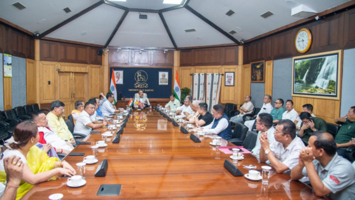 Community representatives gather during a meeting as discussions continue over the proposed Chief Minister's visit to Lamka.