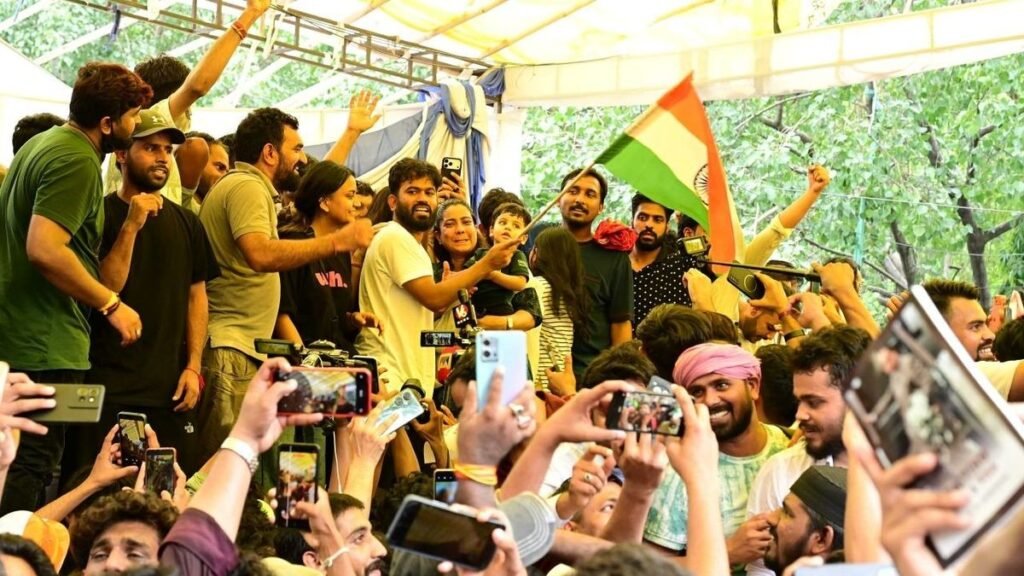 Young supporters engage with digital platforms during a political movement highlighting the transition from online meme culture to organised public participation.